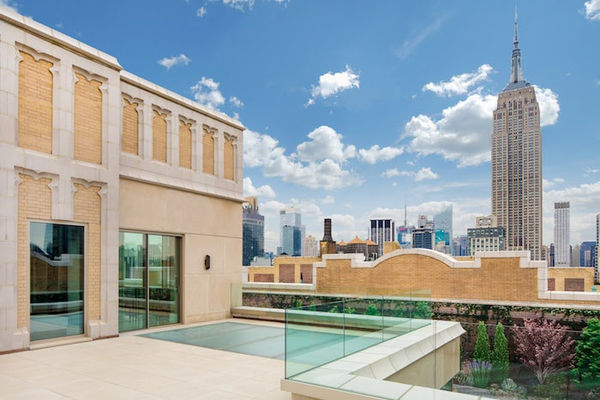 Outdoor view from a stone terrace facing north to the Empire State Building in New York City.