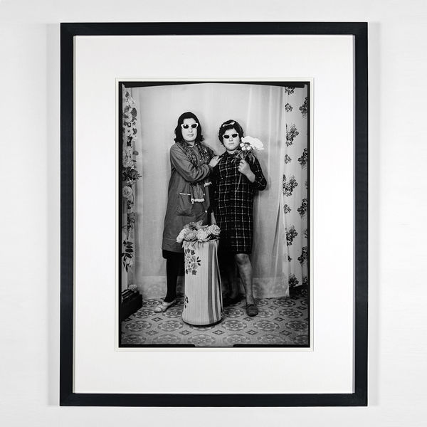 1960s black & white portrait photograph of a young girl in traditional garb, in a photo studio