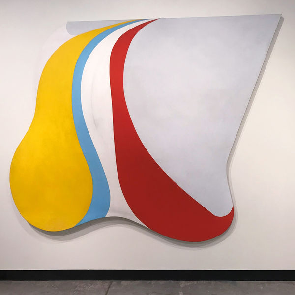 Tridimensional shaped canvas yellow, blue, white, grey and red painting by artist Charles Hinman at the TCNJ Art Gallery Group Exhibition