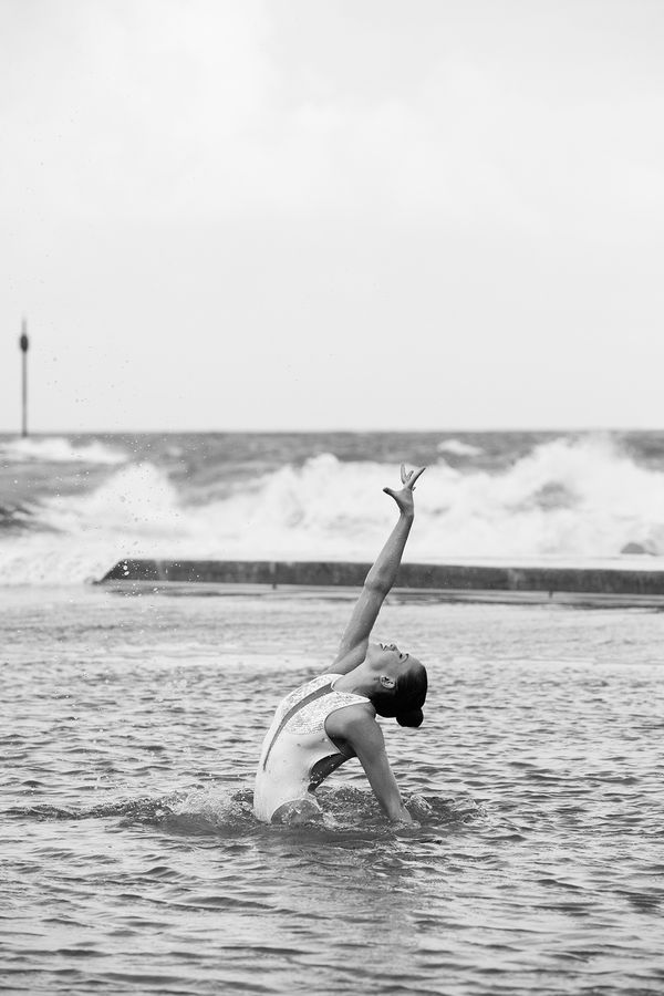 Movement study - Swimming 1. Synchronised swimmer Genevieve Randall. At Bude sea pool, Cornwall, UK. Prints of athletes. By movement photographer Simon Tomkinson.