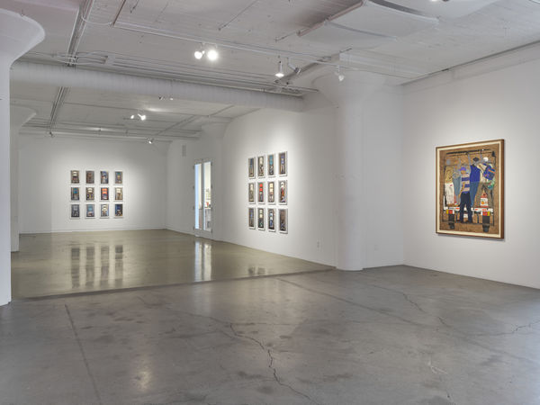 Image of Arleene Correa Valencia's Si Llega Uno, Llegamos Todos / If One Of Us Makes It, We All Make It (2025) installed in the south gallery, with two grids of Alejandro Cartagena's Carpoolers (2011 - 2012) installed in the north gallery.