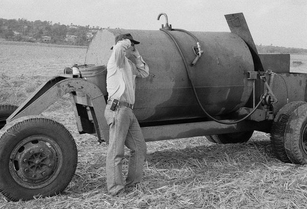 Michael on the Phone, Brighton Farm, St. George, Barbados, 2010 Selenium Toned Silver Gelatin Print, 16x20" Archival Pigment Print on Moab Entrada Rag, 17x21" Edition of Three
