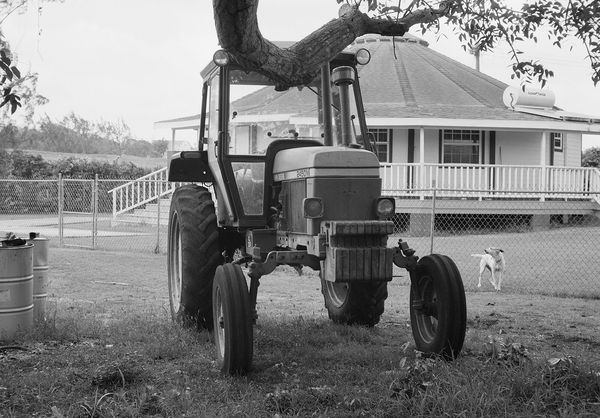 Tractor Parked by Richard's House, Brighton Farm, St. George, Barbados, 2023 Selenium Toned Silver Gelatin Print, 16x20" Archival Pigment Print on Moab Entrada Rag, 17x21" Edition of Three