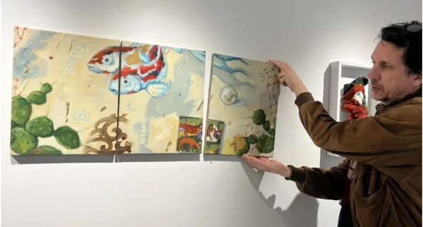 Rupert Shrive with “Infinity triptych”, oil on linen, 2023, which can be moved around indefinitely