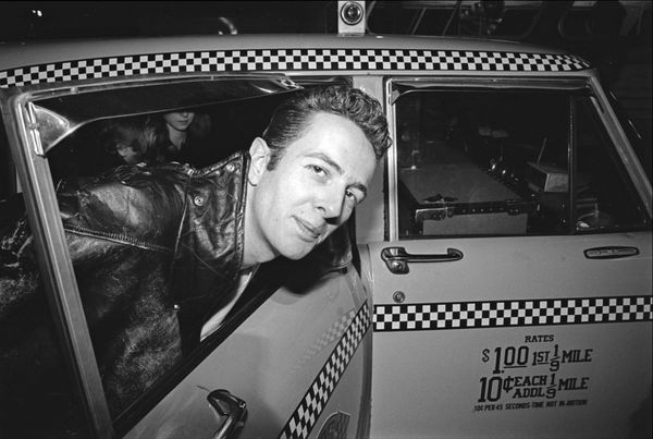 Allan Tannenbaum, Joe Strummer of The Clash Enters a Taxi at JFK Airport, 1981