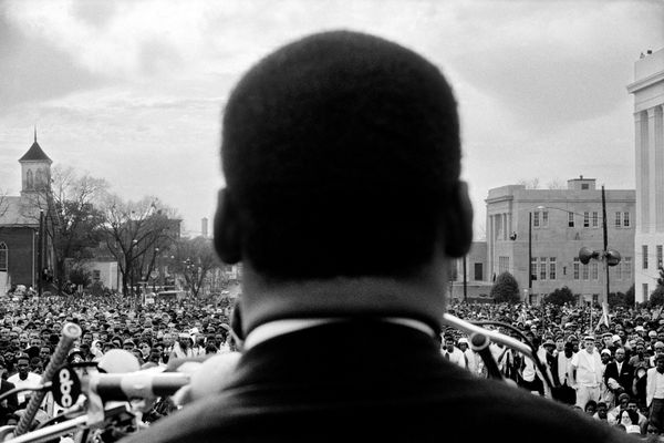 Stephen Somerstein, Dr. Martin Luther King, Jr., seen from behind, addressing crowd of 25,000 civil rights marchers, in front of Alabama State House, 1965 Selma to Montgomery civil rights march, March 25, 1965