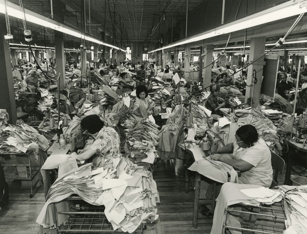 Bill Owens, I'm a refugee from China. I sew pockets on pants. Every day I have work, and living here is easy. In China it's hard to find a job. Someone has to recommend you. I don't speak English and I'm too old to learn so I'll never get a better job., 1976