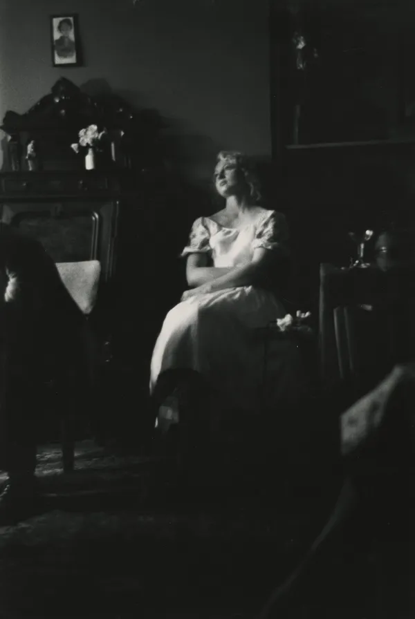 Larry Siegel, Seated woman in white dress, NYC, 1960