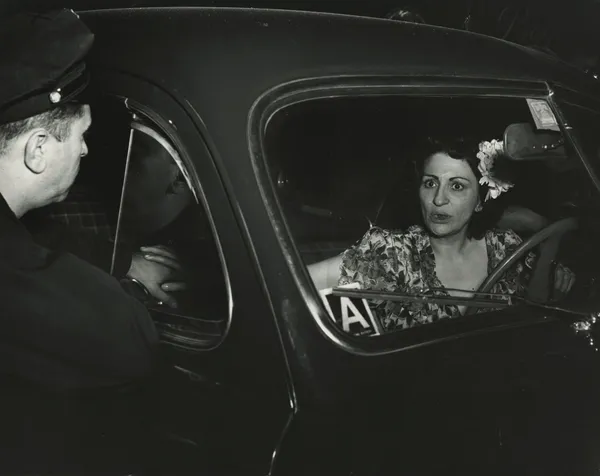 Weegee, Shock. Sudden Death for One...Sudden Shock for the other. Mrs. Dorothy Reportella, Accused of Hitting Bread Truck with her Car, Sept. 7, 1944