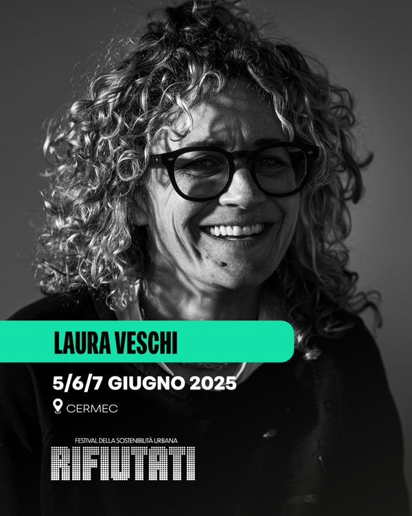 Black and white portrait of Laura Veschi, photographer and visual artist, taken for her participation in the Rifiutati Urban Sustainability Festival, held at Cermec on June 5–7, 2025. Her smile and the grazing light shaping her face convey the energy and