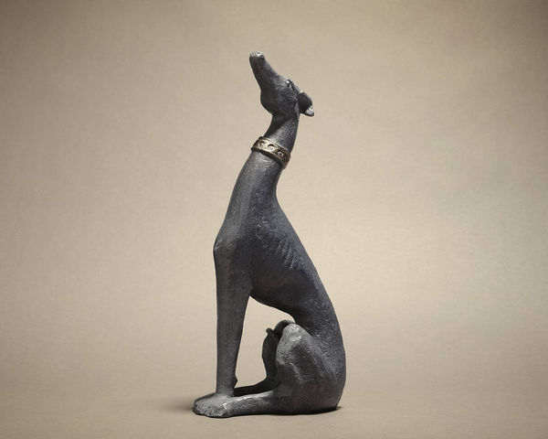 A bronze dog sculpture by Pedro Rodriguez Pedrín