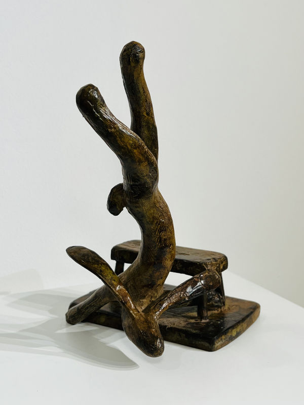 Handstand Hare Next to a Chair Bronze Sculpture by Guy du Toit