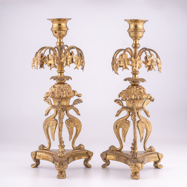 A pair of Regency ormolu candle lustres