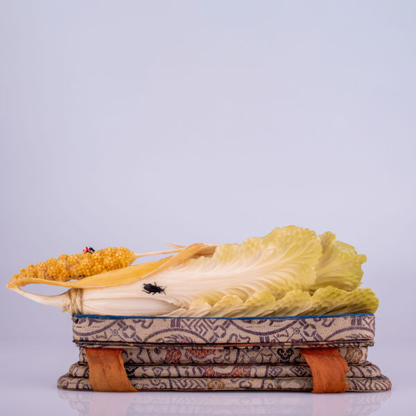 A Chinese carved canton ivory polychromed fruiting pod, naturally modelled and overlaid with insects, early 20th century