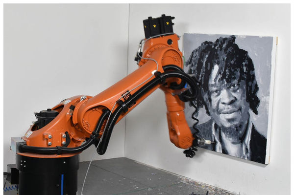 A robot painting a portrait of Yinka Shonibare by Rob and Nick Carter