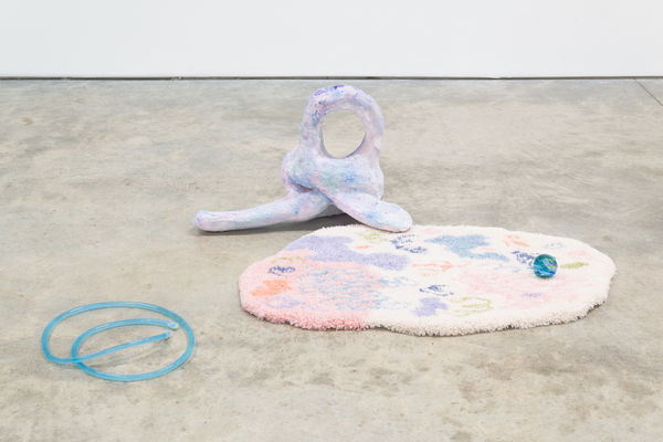 Sebastian Sochan .Hold me closer and I’ll keep you warm 2020-21, Sugar, foam, plaster, pigment, essential oils, dye, tube, water, rug and handblown glass, 28 x 100 x 65 cm
