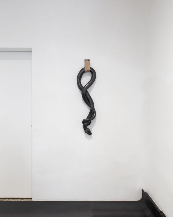 fig 33.8 we are in the wilderness, 2022 Graphite over ceramic, leather 42 x 10.5 x 4 in 106 x 27 x 10 cm