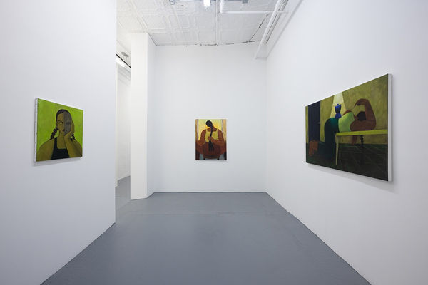 Installation photo of Hilda Palafox paintings of green women