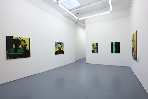 Installation photo of Hilda Palafox paintings of green women