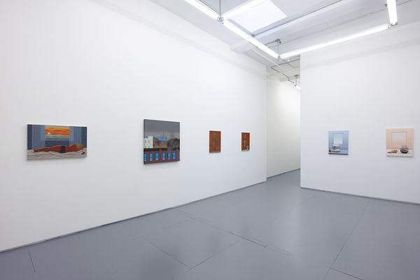 installation photo of "room with a view" exhibition featuring paintings by various artists in white walls