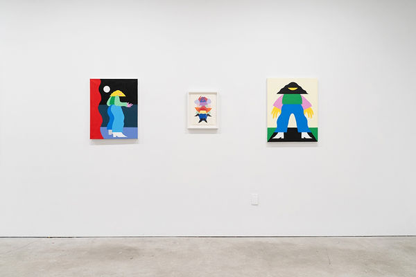 Installation view, from straight on, of three paintings in Marbie's solo show "Good Love is Hard to Find," where images of abstracted figures, rendered in bright, color blocked hues, pose in various positions.