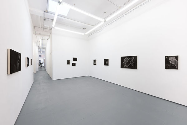 Installation view of Angela Fang Zirbes exhibition "House & Ghosts" featuring various grey scale paintings