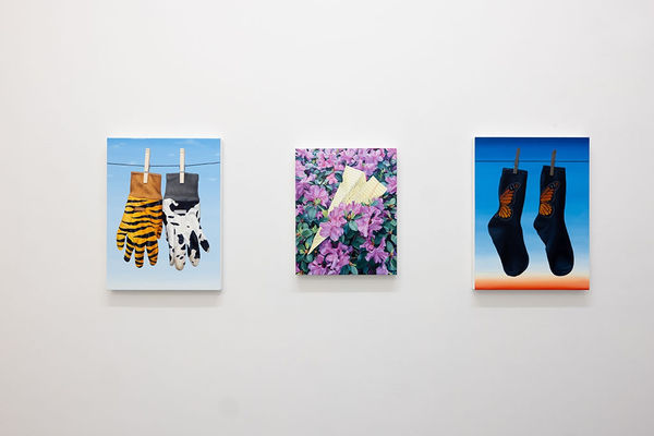 installation image of three Sara Suppan paintings hung on a white wall 