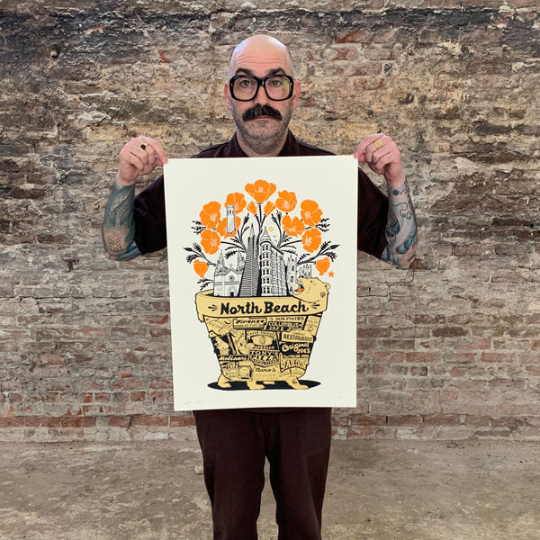 Jeremy Fish holding art print