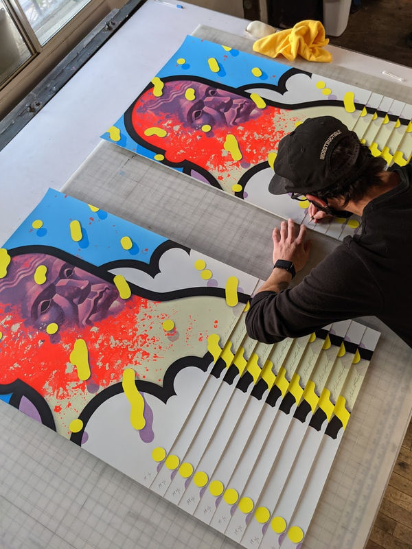 Artist Michael Reeder signing prints