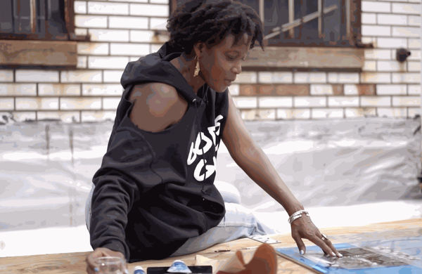 Still from Season 1, Episode 3, "Adama Delphine Fawundu (AD, CC)", of The Darkroom MCs series (1:14).