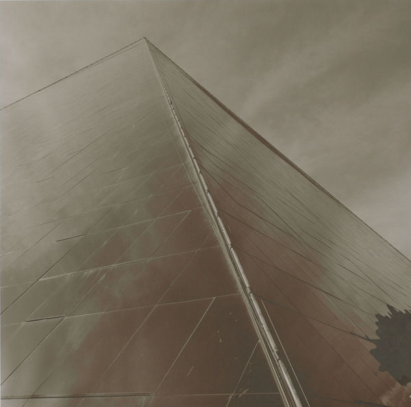 Luxor in pyramid shape with small amount of sky as negative space behind building