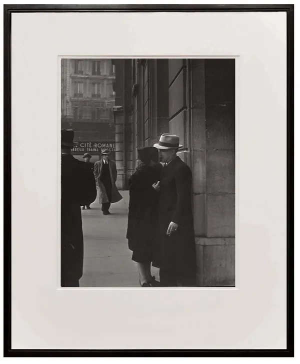 couple kissing at the Saint Lazare train station by Brassai