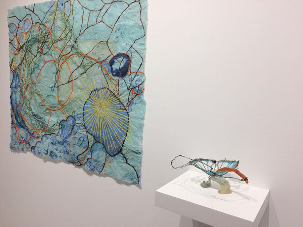 Installation shot of two art pieces by Nancy Cohen. From left to right, the pieces are "Dissolution" and "Momentary" respectively.