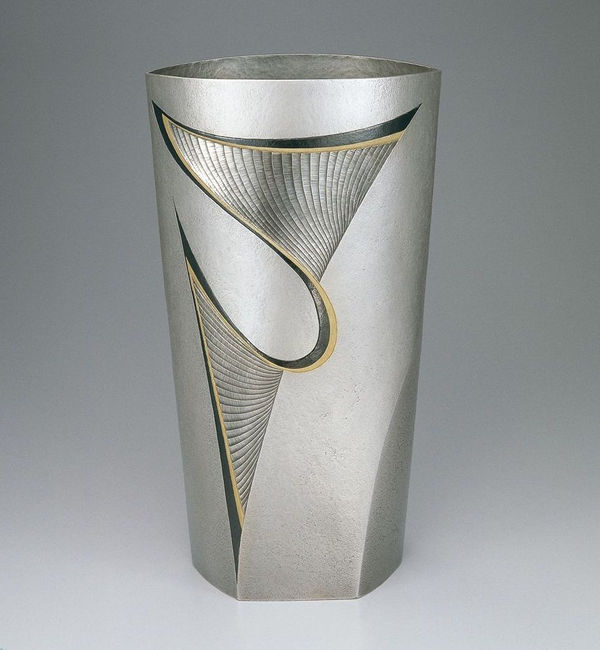 Silver Vase "Yo" (Leap), 1998 Silver metal carving with gold decoration and shakudo (alloy-copper, gold) 13 3/4 &times; 5 5/8 &times; 6 in (35 &times; 14.3 &times; 15.2 cm)
