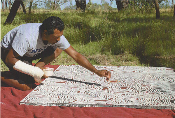 Lloyd Kwilla painting in Kununurra, Western Australia