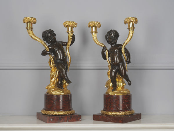 Louis-Félix de Larue, A pair of Louis XVI figural candlesticks attributed to Louis-Félix de Larue (after Clodion), Paris, date circa 1780