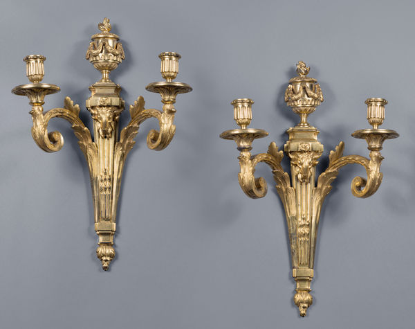 Jean-Charles Delafosse (in the style of), A pair of Louis XVI two-light wall-lights in the style of Jean-Charles Delafosse, Paris, date circa 1770