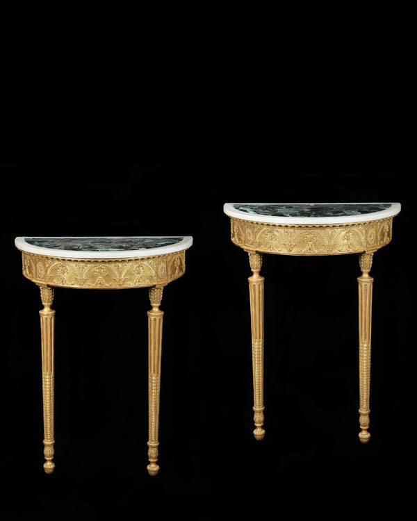 A PAIR OF GEORGE III GILTWOOD CONSOLE TABLES