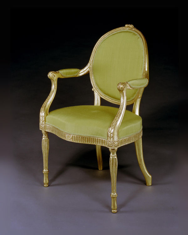 A GEORGE III GILTWOOD ARMCHAIR ATTRIBUTED TO THOMAS CHIPPENDALE