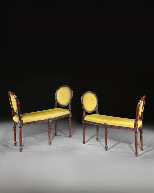 A PAIR OF GEORGE III MAHOGANY WINDOW SEATS