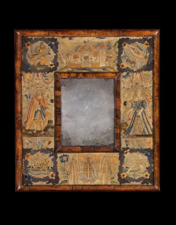 A CHARLES II STUMPWORK MIRROR IN A COCUS WOOD AND WALNUT FRAME