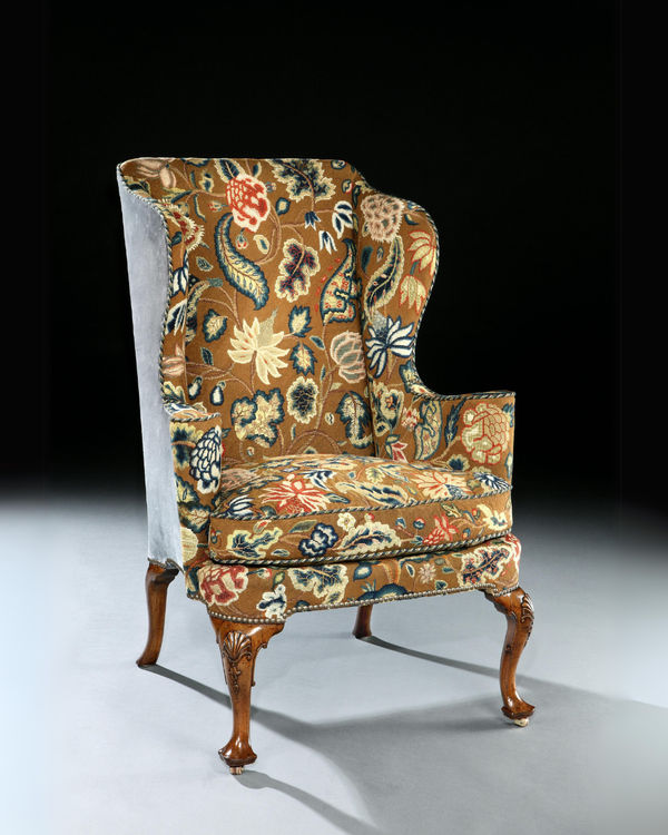 A QUEEN ANNE WALNUT WING CHAIR, English, circa 1710