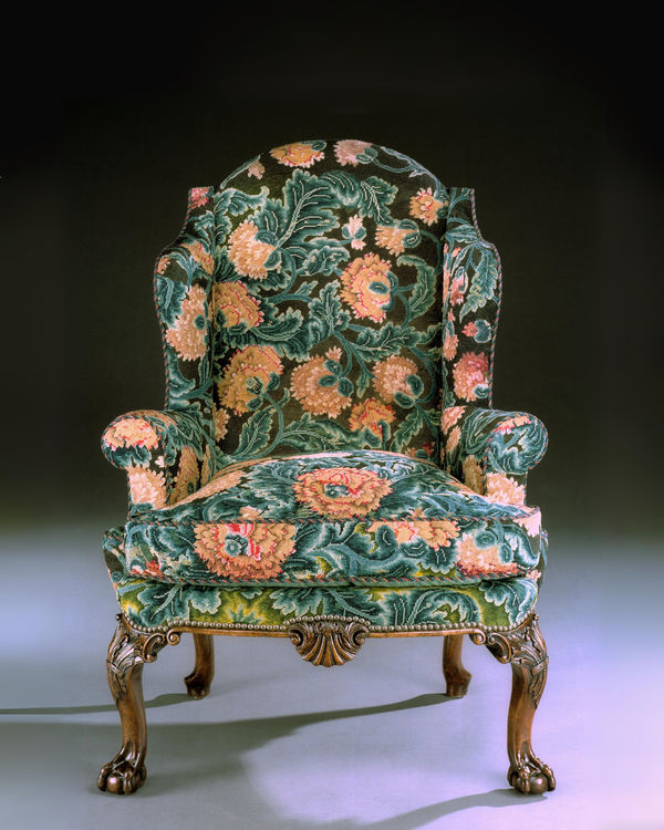 A GEORGE II WALNUT WING ARMCHAIR, English, circa 1735