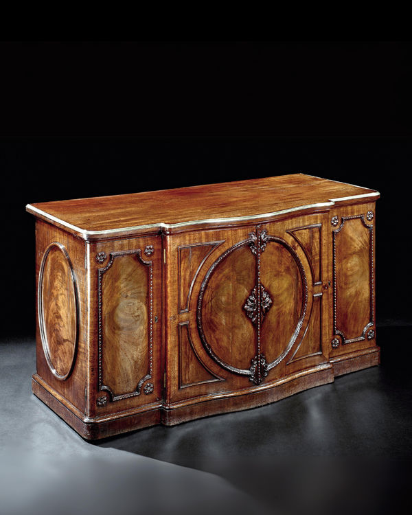 A MAHOGANY COMMODE ATTRIBUTED TO JOHN BRADBURN, English, circa 1765