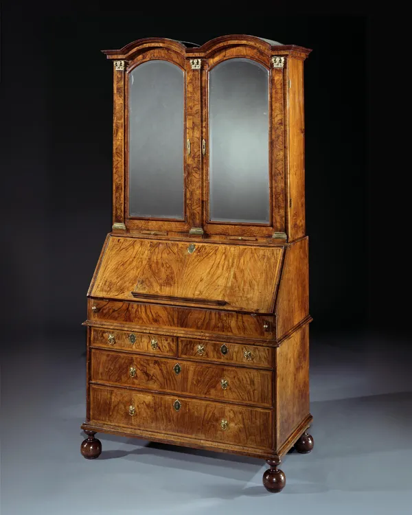 A GEORGE I WALNUT BUREAU CABINET
