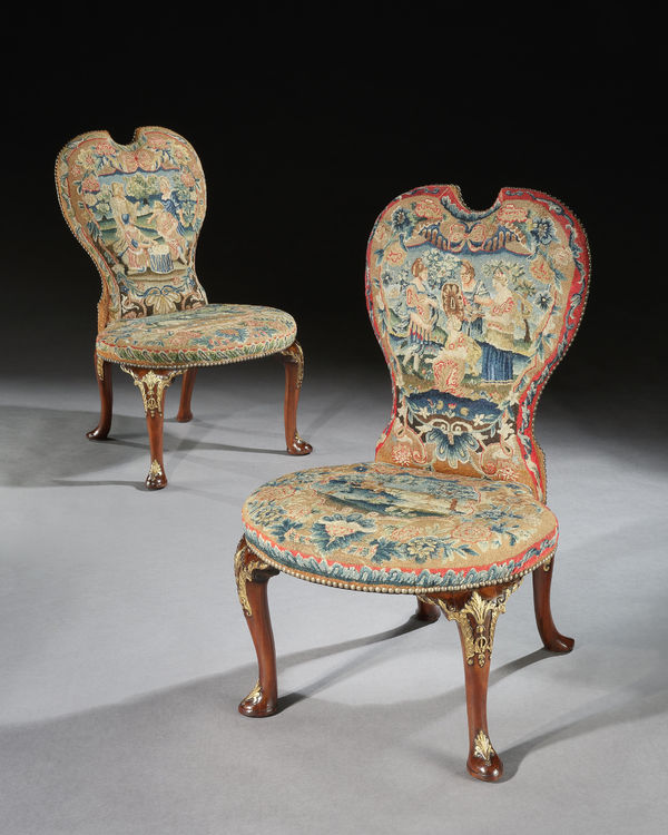 A PAIR OF GEORGE II CHAIRS ATTRIBUTED TO PETER ALEXANDER, The chairs: English, circa 1735 The needlework: English, circa 1735