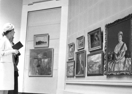 The Queen viewing a portrait of her mother during the 1961 Annual Exhibition.