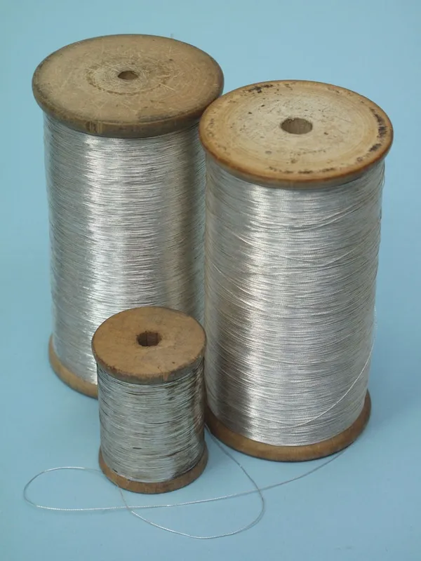 A selection of bullion thread and trimmings in both gold and silver.