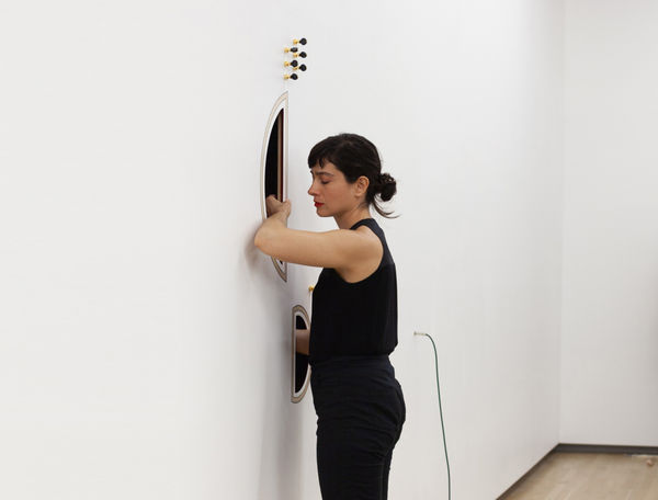 Still image of Naama Tsabar playing Inversion work in the gallery