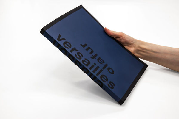 cover of Olafur Eliasson Versailles book held in someone's hand